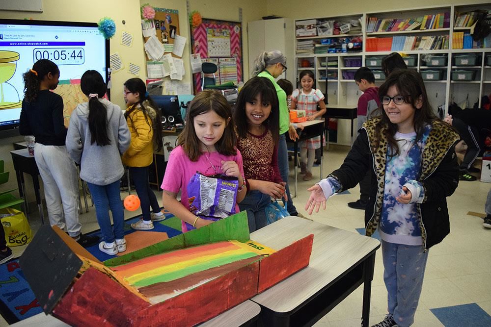 Students play a game during Caines Arcade